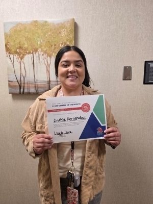 Cinthia Hernandez poses with a certificate