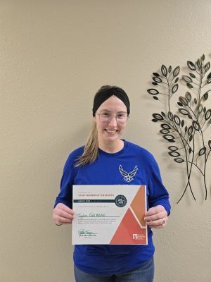 Kylie Gilmore holding a certificate
