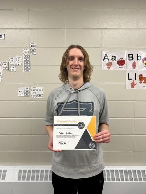 Robert Gottburg holding a certificate