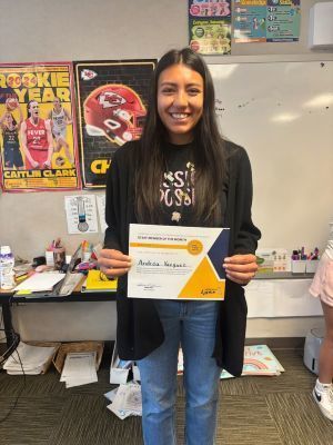 Andrea Vazquez holding a certificate