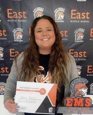 Mary Perez holds a certificate