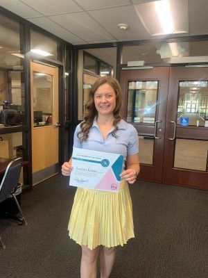 Rachel Fuller poses with a certificate