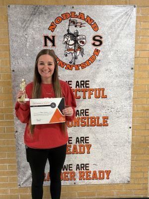 Peyton Schmith poses with a certificate