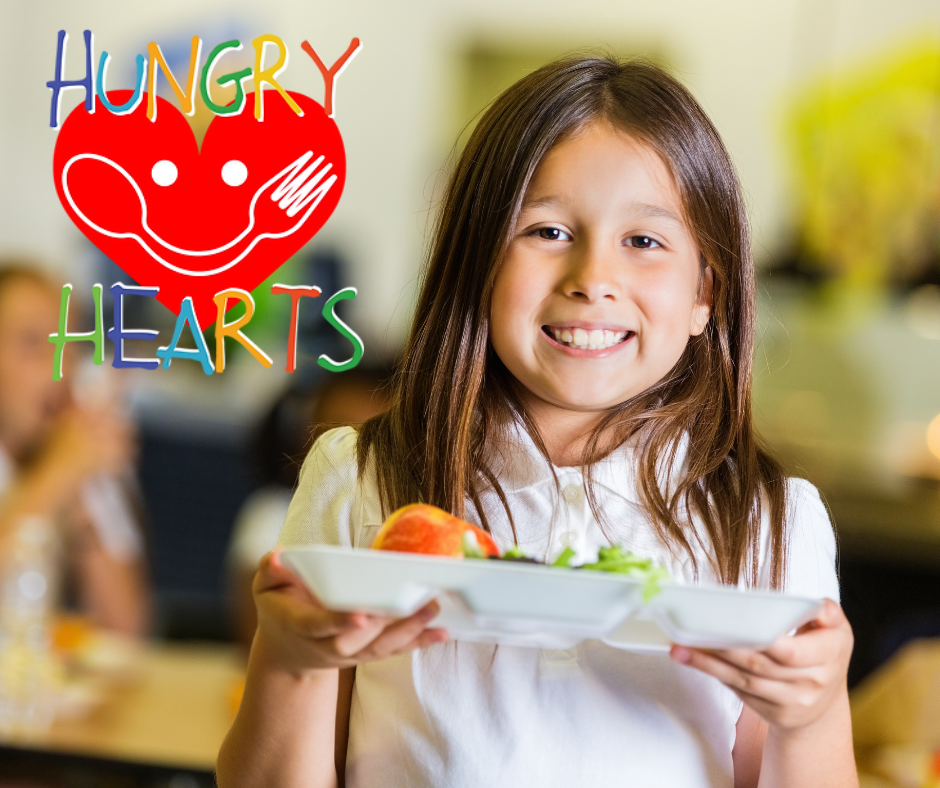 girl holding school lunch