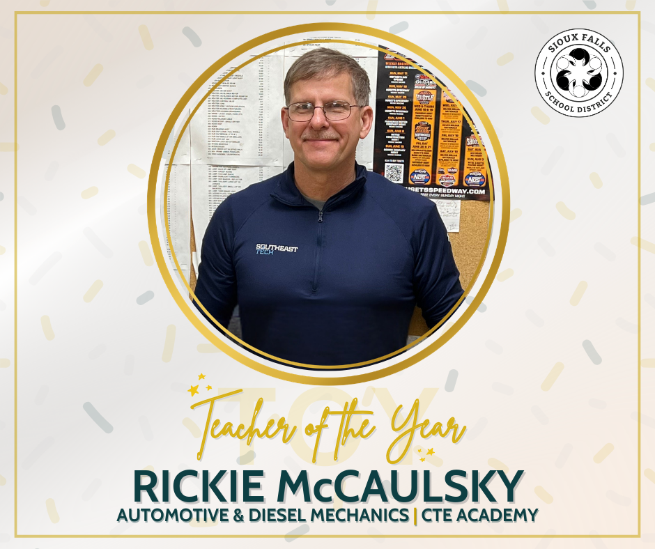 White male wears a navy blue Southeast Tech polo and smiles at the camera