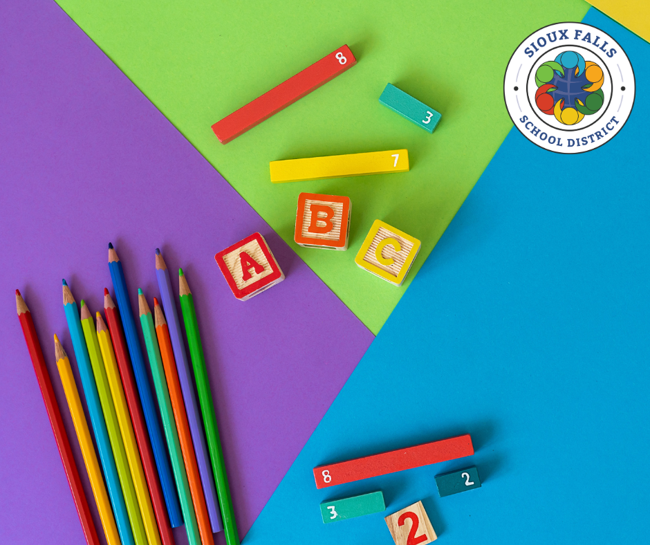 colored pencils and blocks on a bright floor