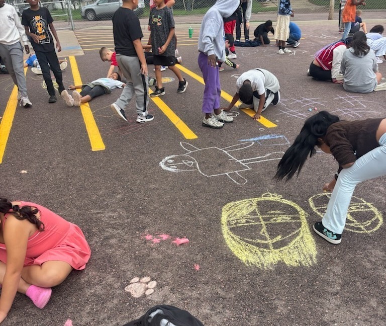 students drawing with chalk