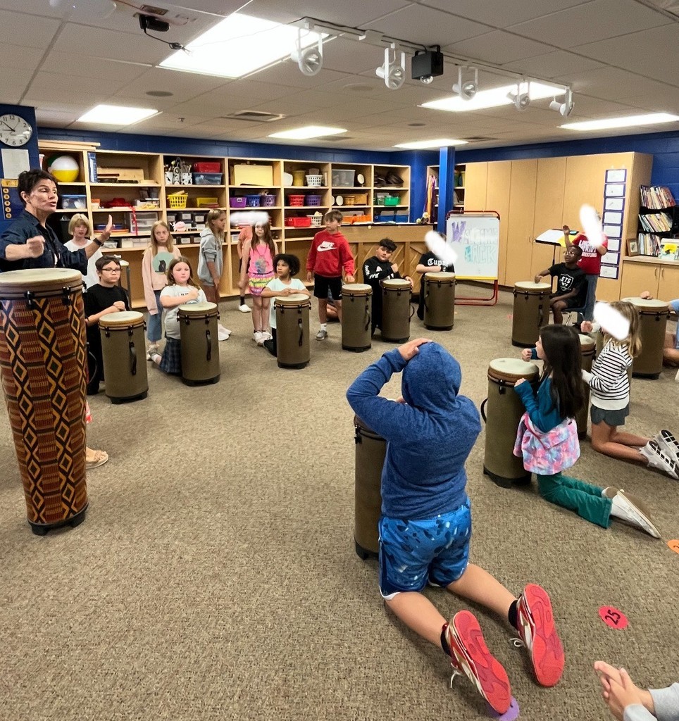 4th graders drumming in music 