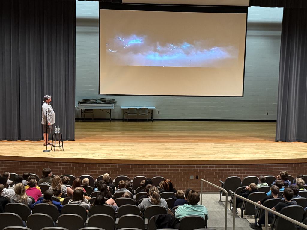 Chris Chittick speaks about storm chasing in the Memorial auditorium.