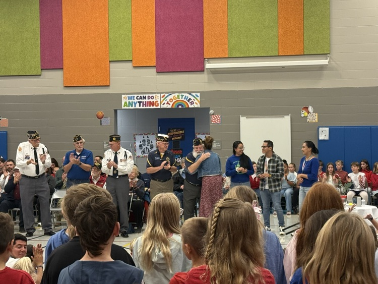 VFW Commander Patrick Branco gives Dr. Vik and 4th grade teachers Yubeth Medina, Wilfredo Petit, and Lissette Moerman Challenge Coins! 