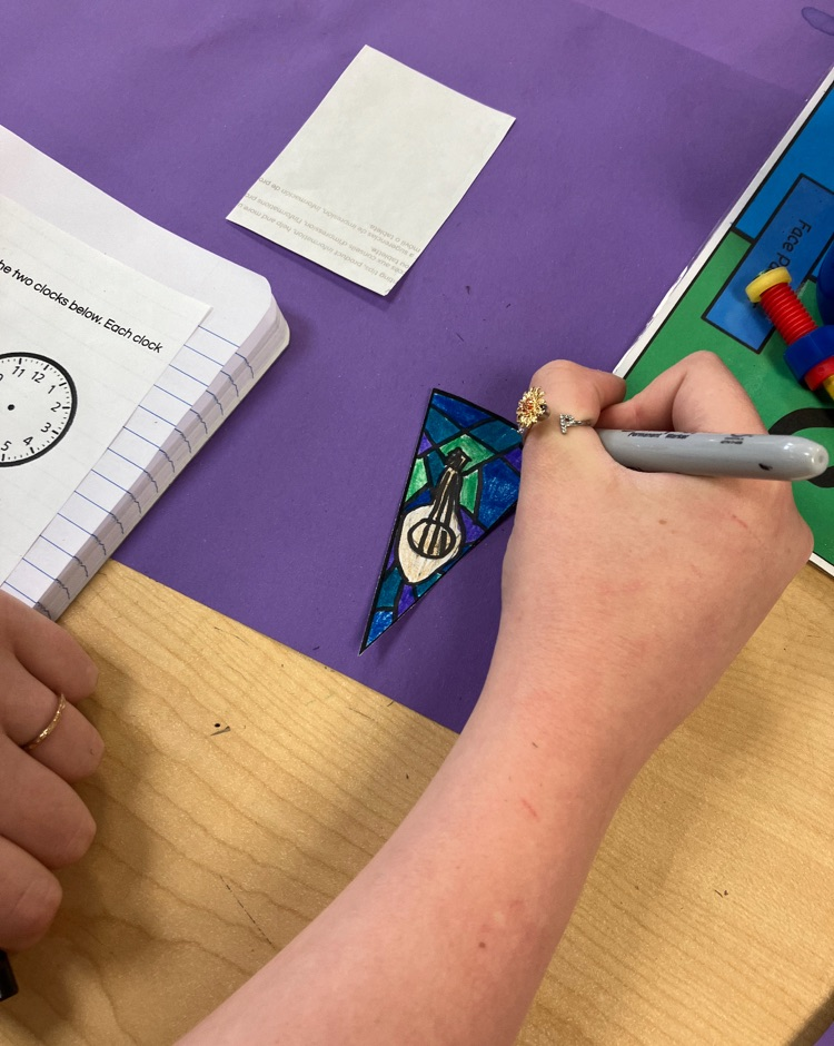 student working on a math and art piece