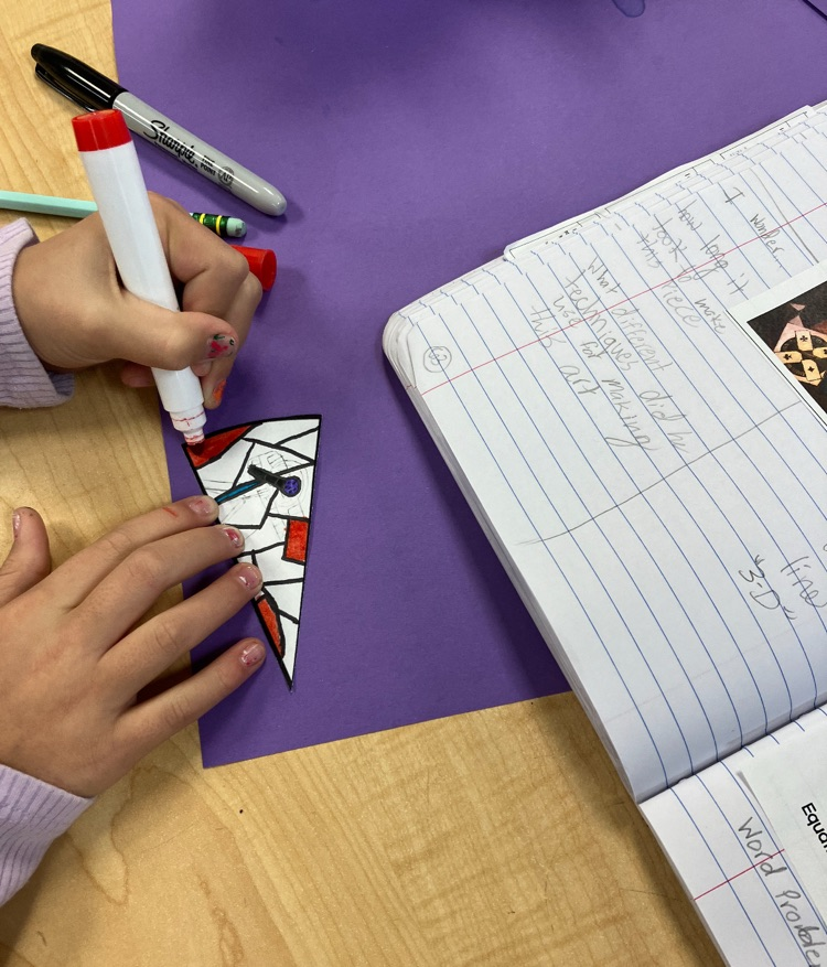student working on a math and art piece