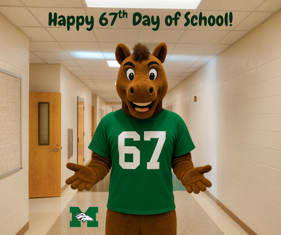 The Memorial Middle School Mustang mascot standing in a blurred school hallway, wearing a green t-shirt with a large white number "67" on it. The mascot is holding its hands out, palms up, in a humorous "shrug" or "explaining" pose.