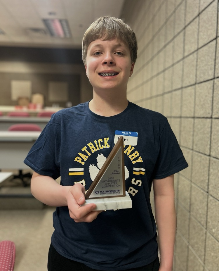 young male holding a trophy