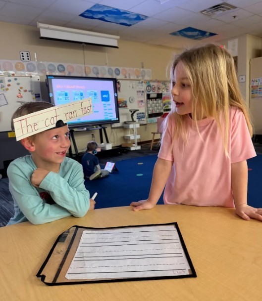 students playing UFLI  writing game