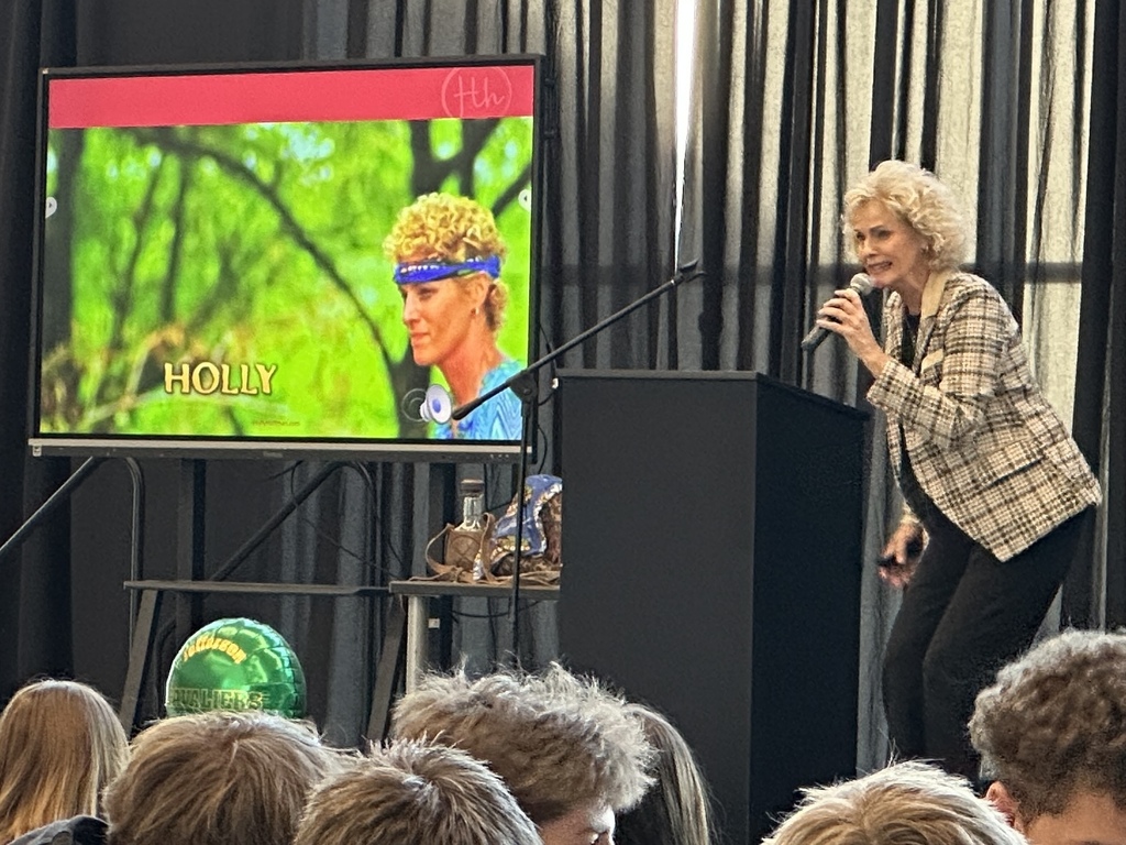 Survivor 21 contestant Holly Hoffman speaking to JHS honor roll students