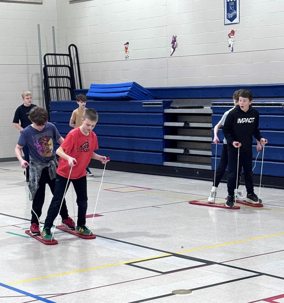 Students cross country skiing in PE class. 
