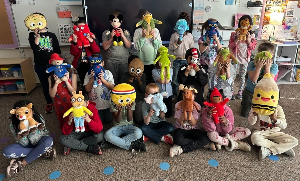 Class 201 pictured with stuffies they practiced CPR on.