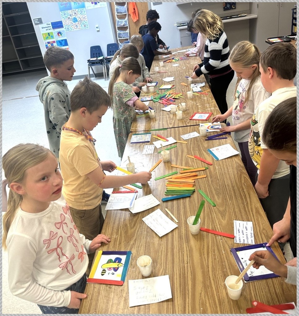 Second grade students making glue. 