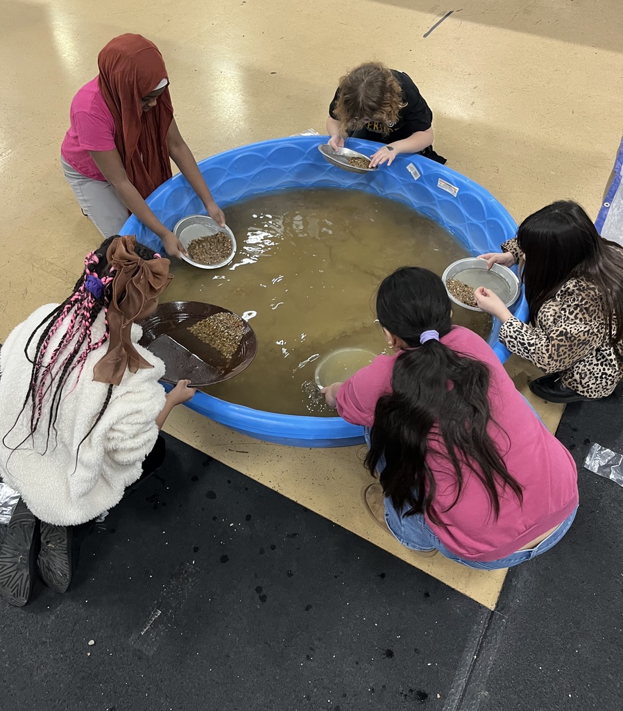 student panning for gold