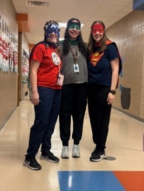 Kindergarten teachers dressed up as superheroes. 