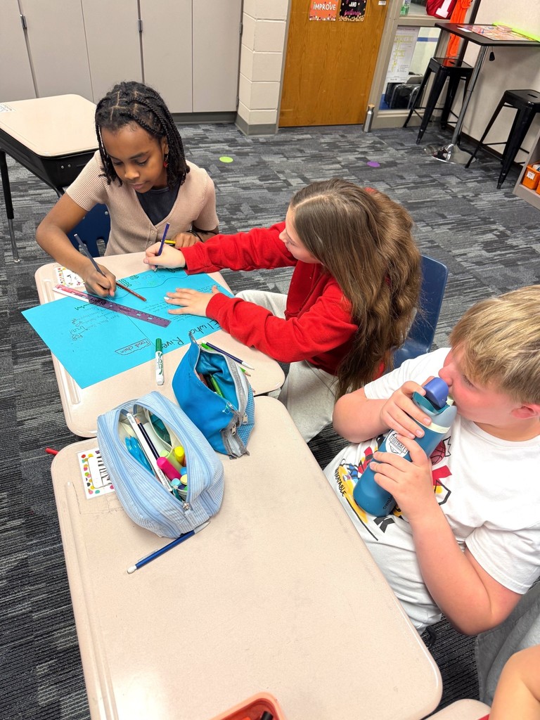 Students writing about ecosystems. 