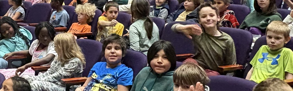 3rd graders waiting for the Young People's Concert to begin
