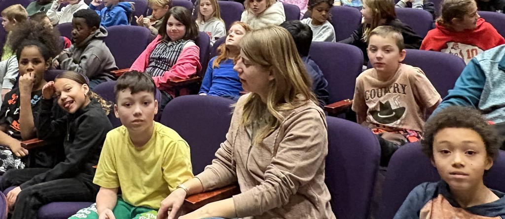 3rd graders waiting for the Young People's Concert to begin