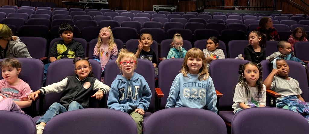 students and teachers in the theater
