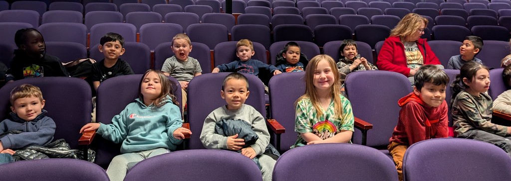 students and teachers in the theater