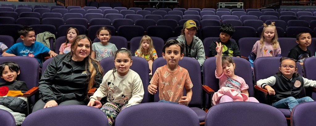students and teachers in the theater