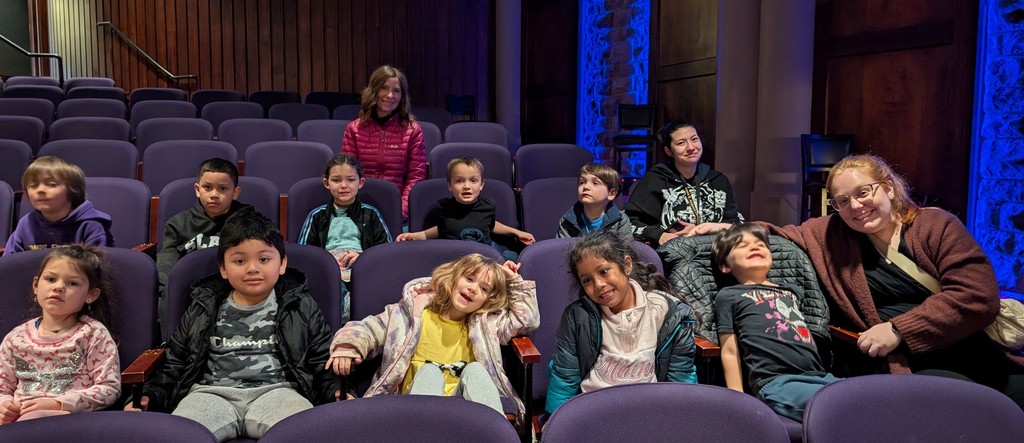students and teachers in the theater