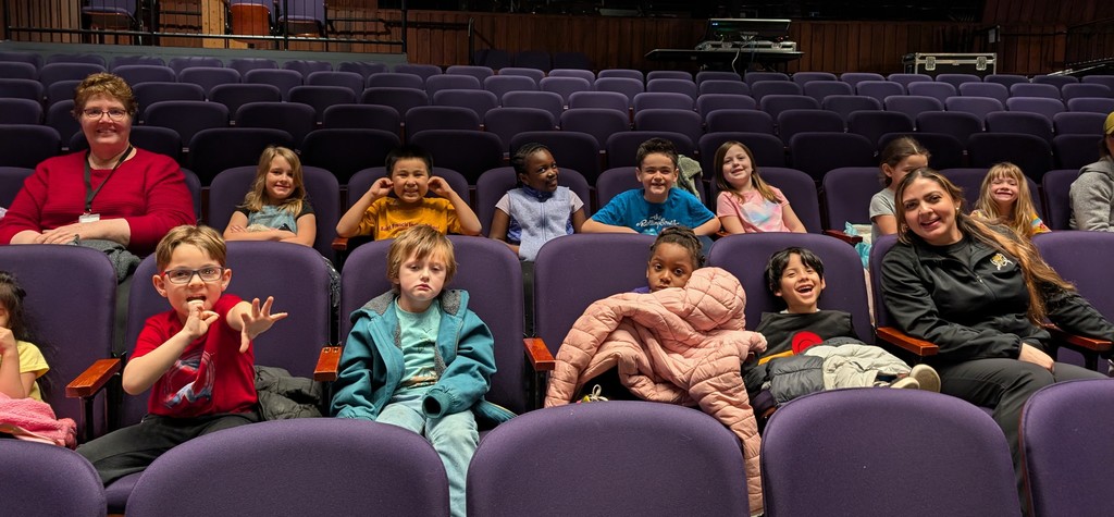 students and teachers in the theater