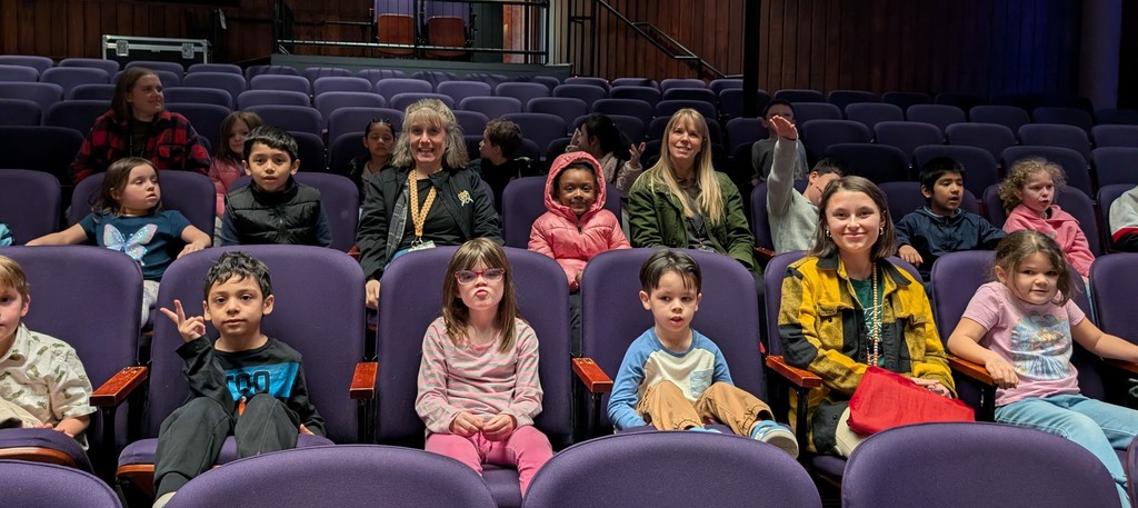 students and teachers in the theater