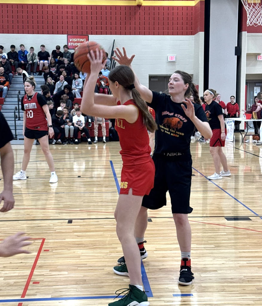 Bison students attempt to set up a play to tie the game in the third quarter