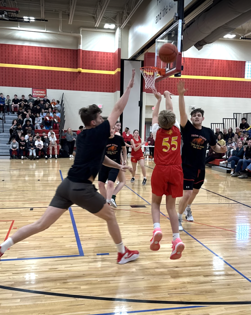 Mr. Dannenbring and Mr. White couldn't quite stop the shot from heading towards the basket.
