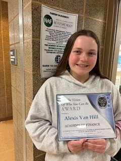 Alexis posing for a picture with her See the Vision Award