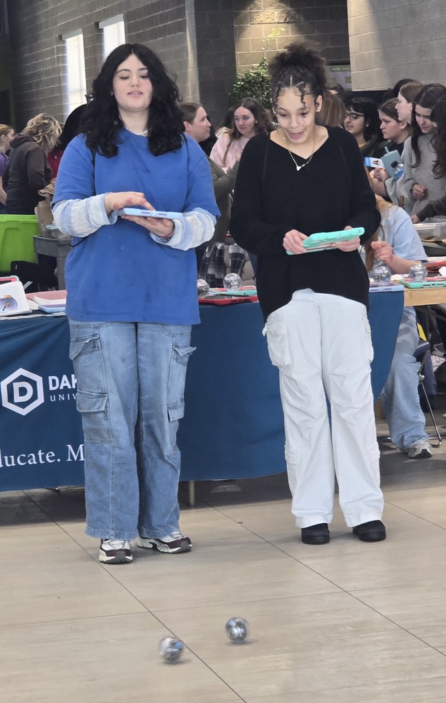 Two students holding tablets.