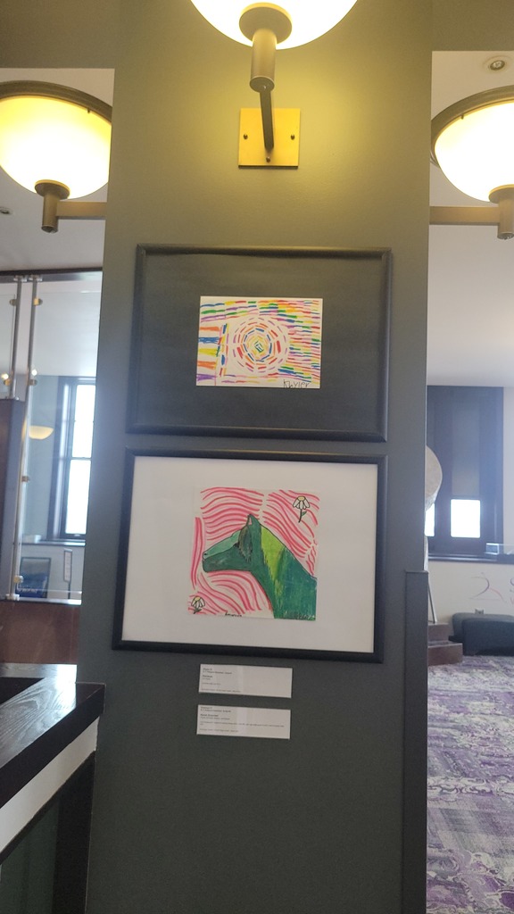 student art being diplayed on a wall
