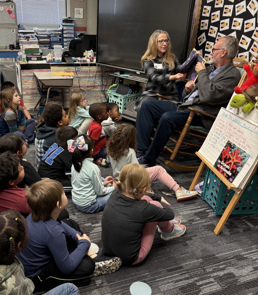 1st grade students enjoying their new books!