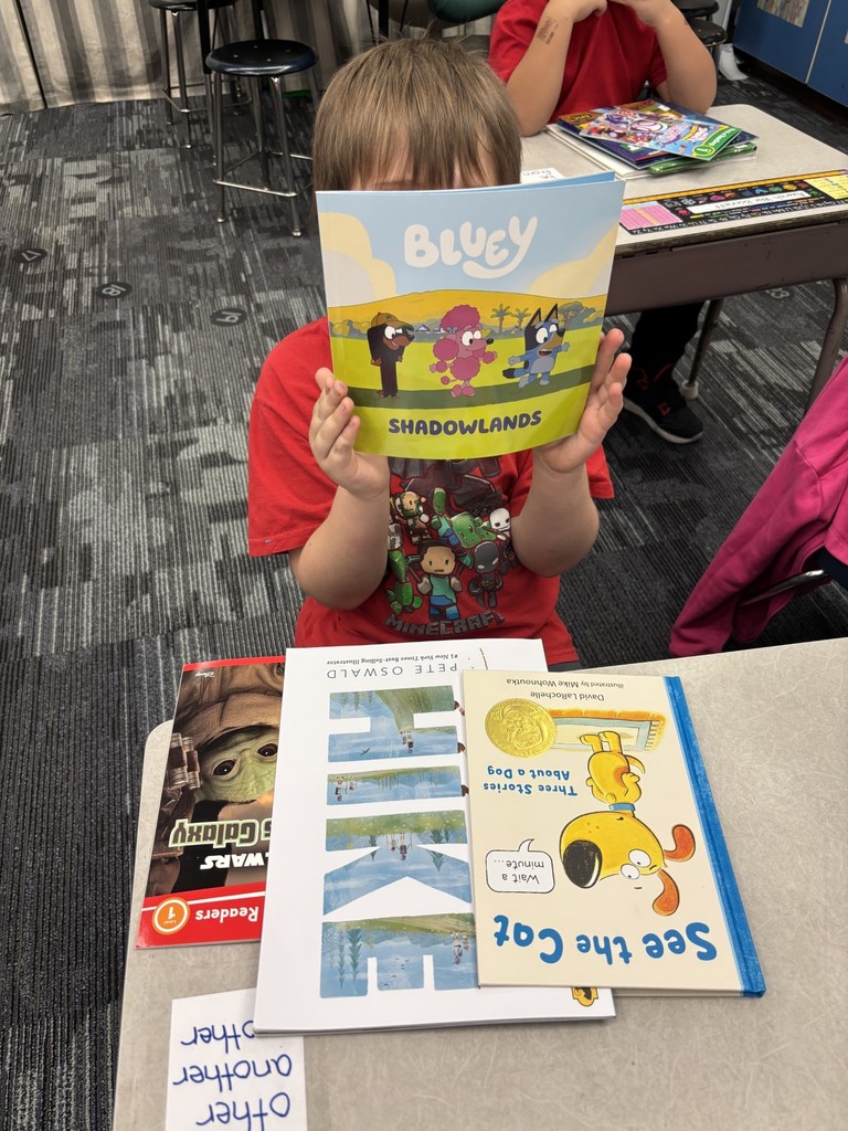 1st grade students enjoying their new books!