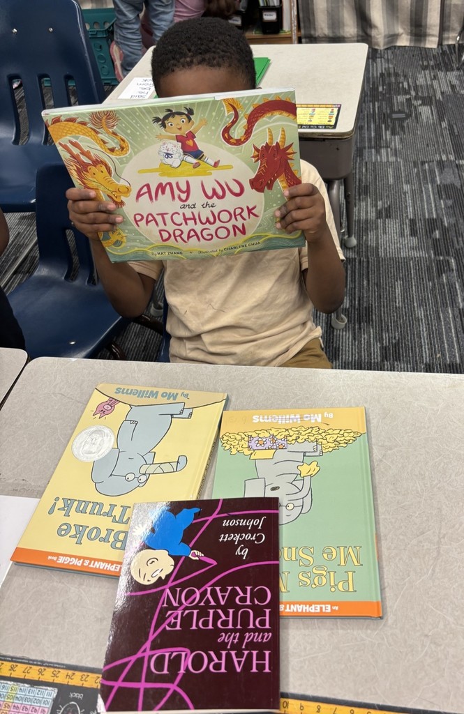 1st grade students enjoying their new books!