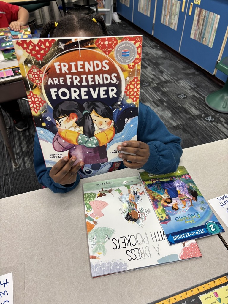 1st grade students enjoying their new books!