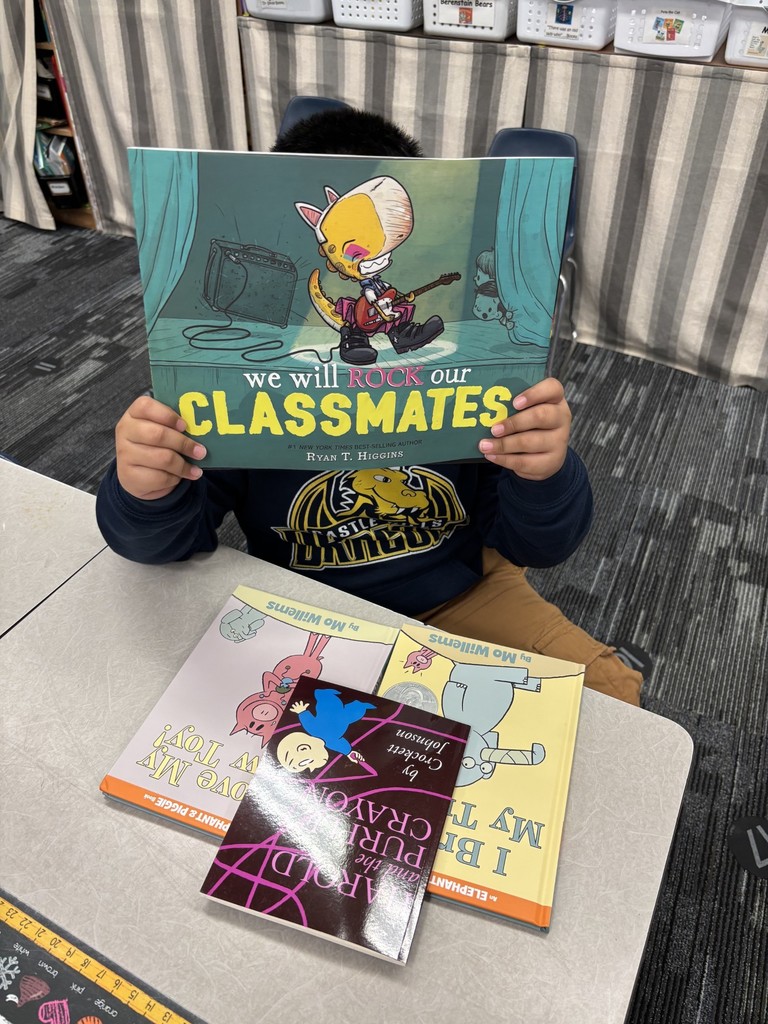 1st grade students enjoying their new books!