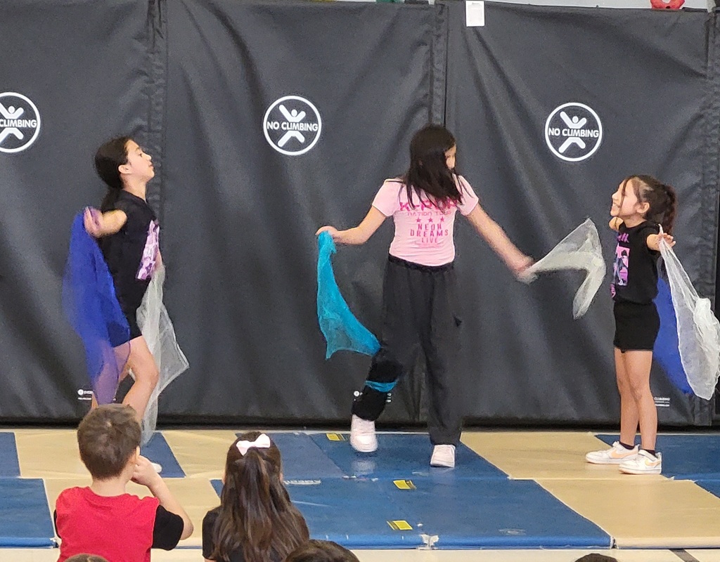 girls dancing with scarves