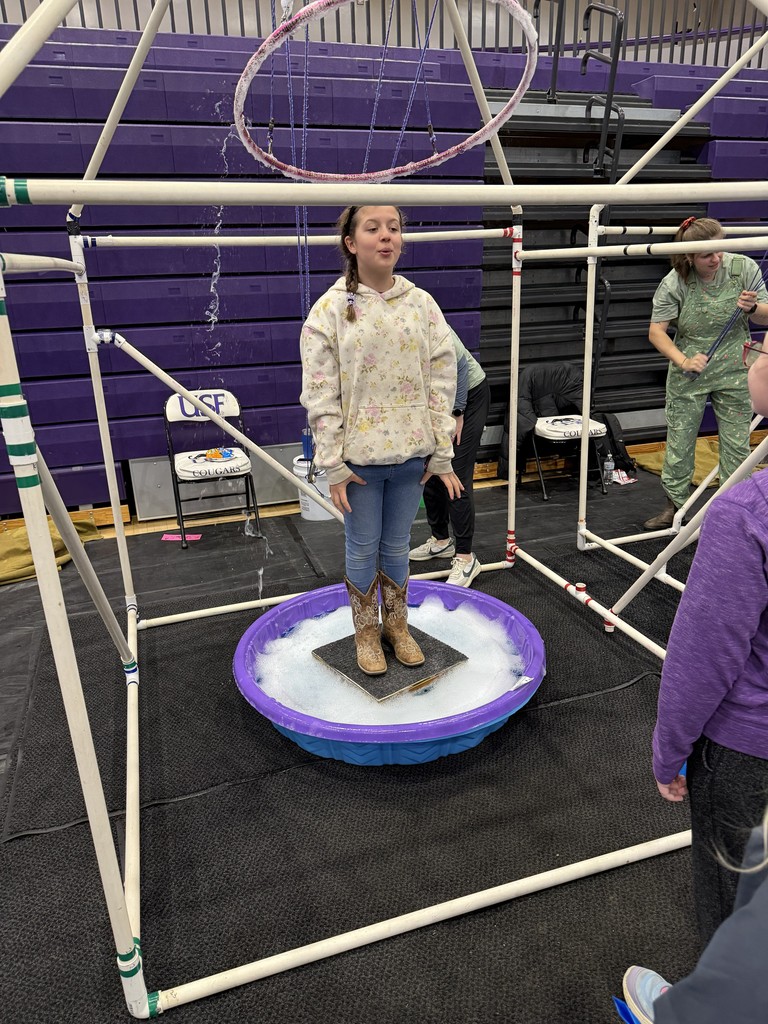 a girl in a large bubble