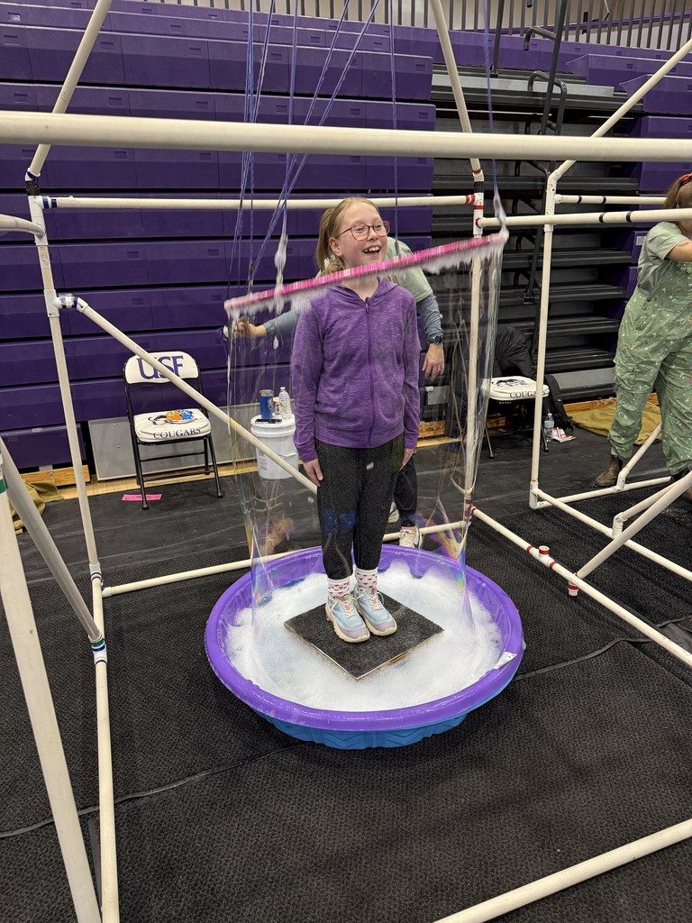 a girl in a large bubble