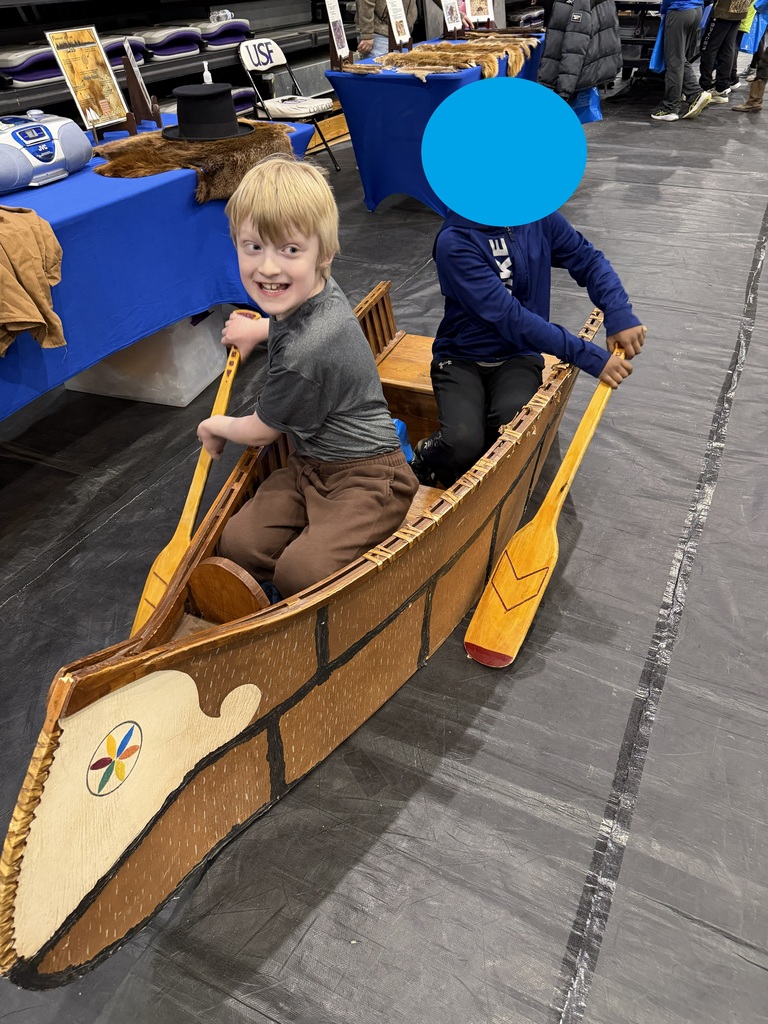 2 boys in a canoe