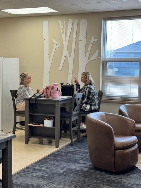 people eating lunch in a staff lounge