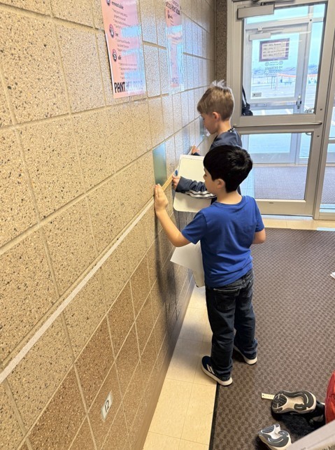 students practicing units of measure with a ruler